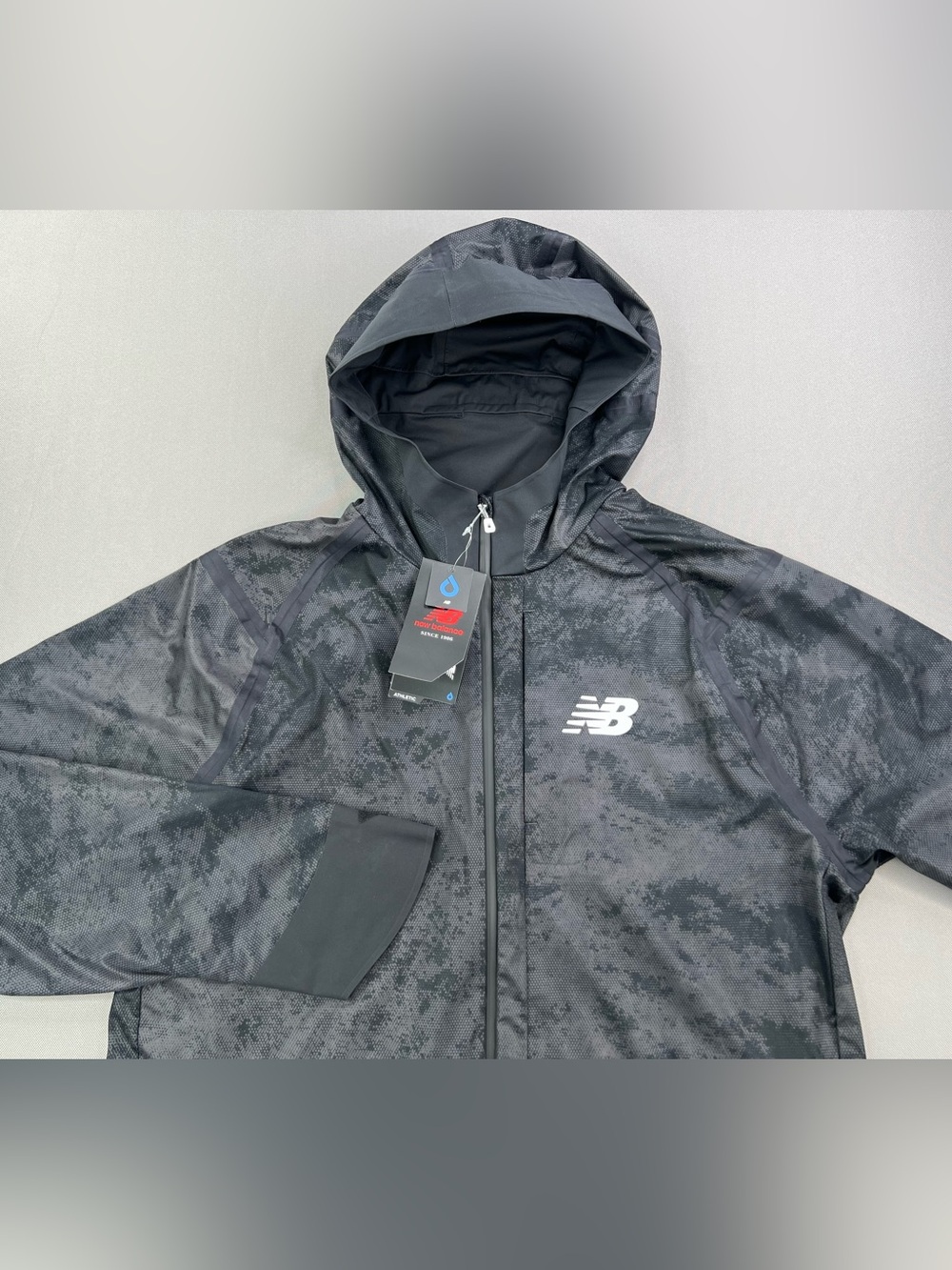 NEW BALANCE ELT AT FULL ZIP WATERPROOF HOODED RAIN JACKET